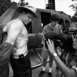 VIETNAM. David Christian was the "Youngest Most Decorated Officer" of the Viet Nam war seen here showing his war wounds to the Vietnamese. He was twice nominated for the Congressional Medal of Honour. He was awarded the Combat Infantry Badge for 30 days under enemy fire. He received the Distinguished Service Cross for using a bayonet to knock out six enemy machine guns. He twice received the Silver Star for valour, and he received a Bronze Star. He was awarded the Air Medal for 25 combat assaults in "hot" landing zones - plus seven Purple Hearts. 1997. George magazine photos